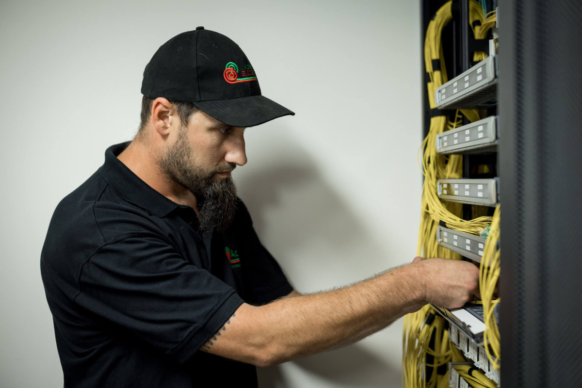 aotea technician working on communications system